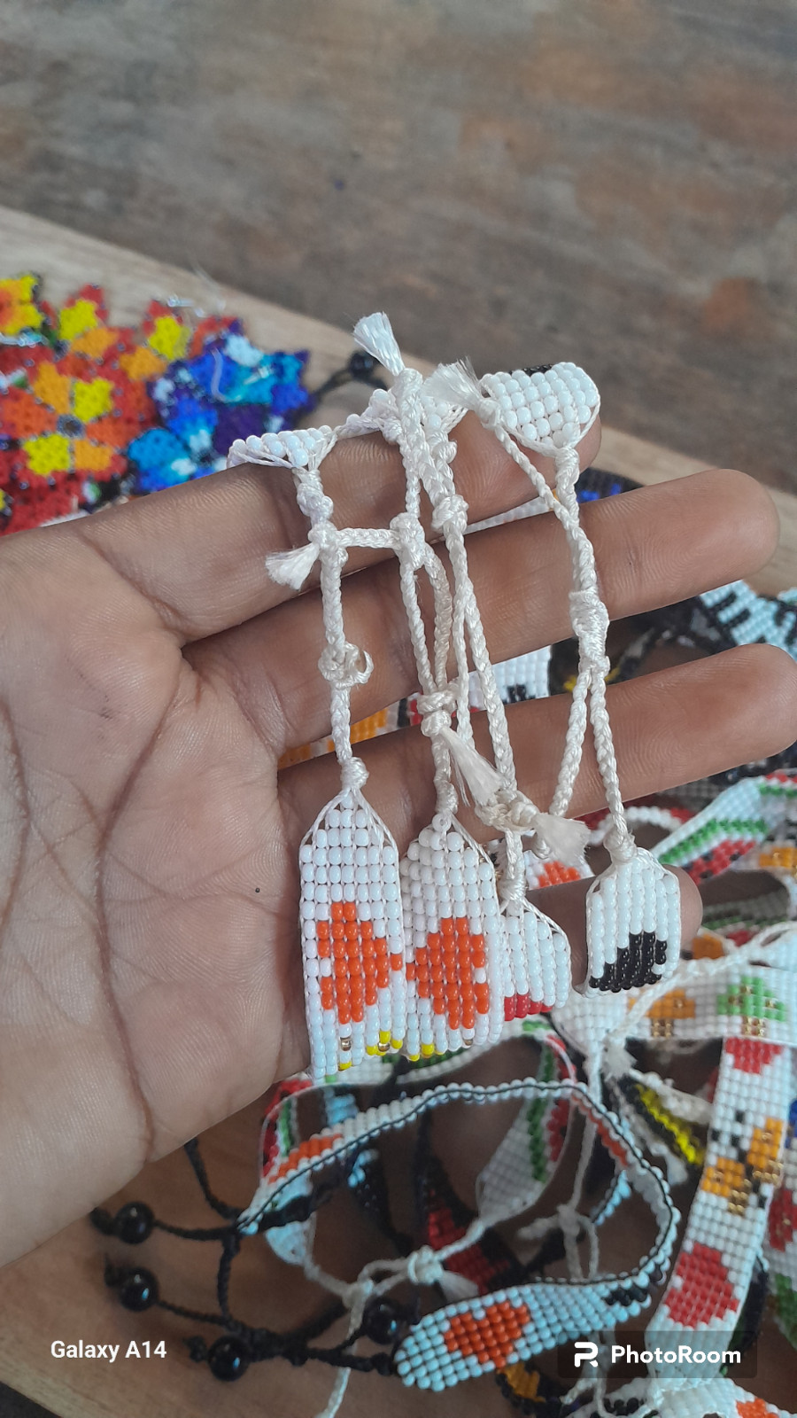 42 BEADED HANDMADE BRACELETS AND 28 PAIRS OF BEADED HANDMADE EARRINGS(LOT OF 70)