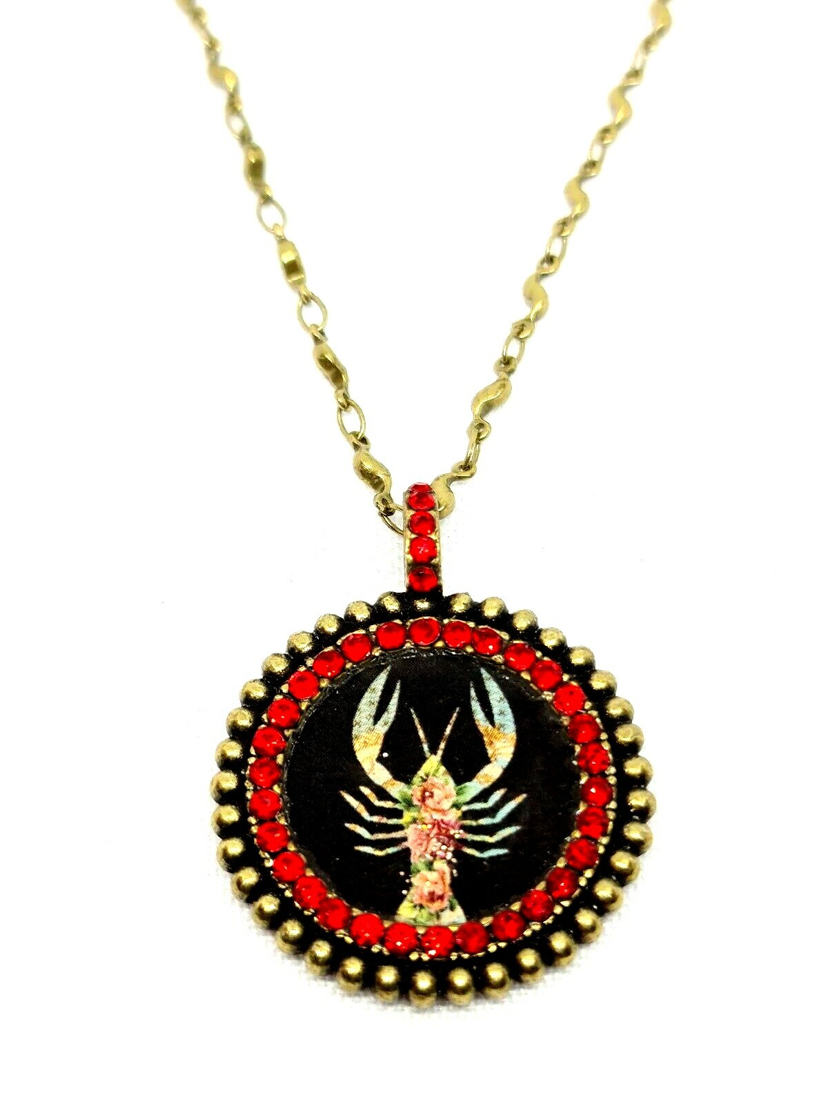 Lovely round Metal Necklace By Michal Negrin Red Crystal Cancer Sign.