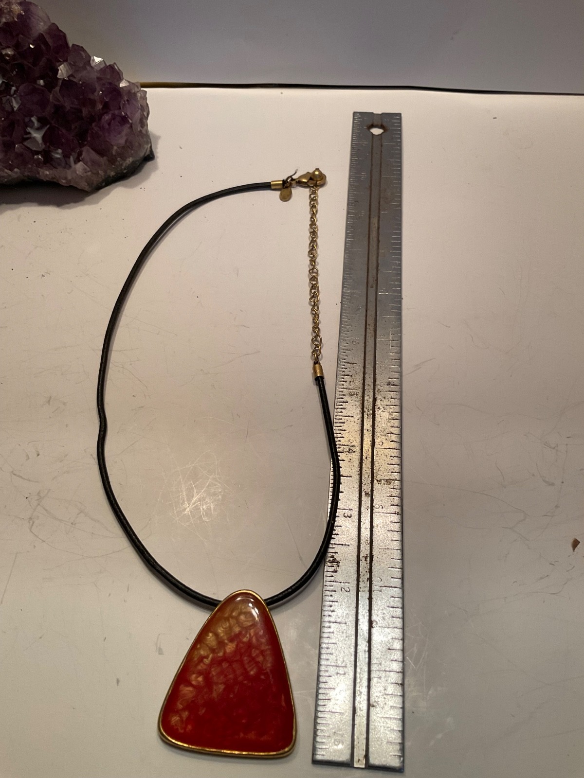 chico vintage ombré orange and red triangular pendant on a black cord