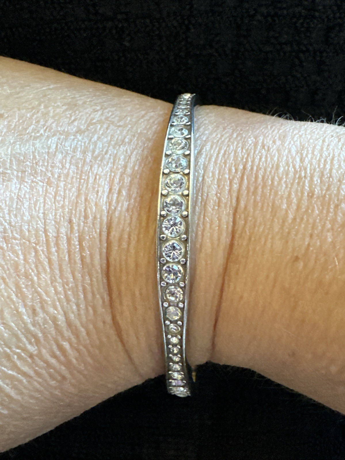 Brighton “Light Hearted” Bangle sparkling, varied-size crystal rhinestones.
