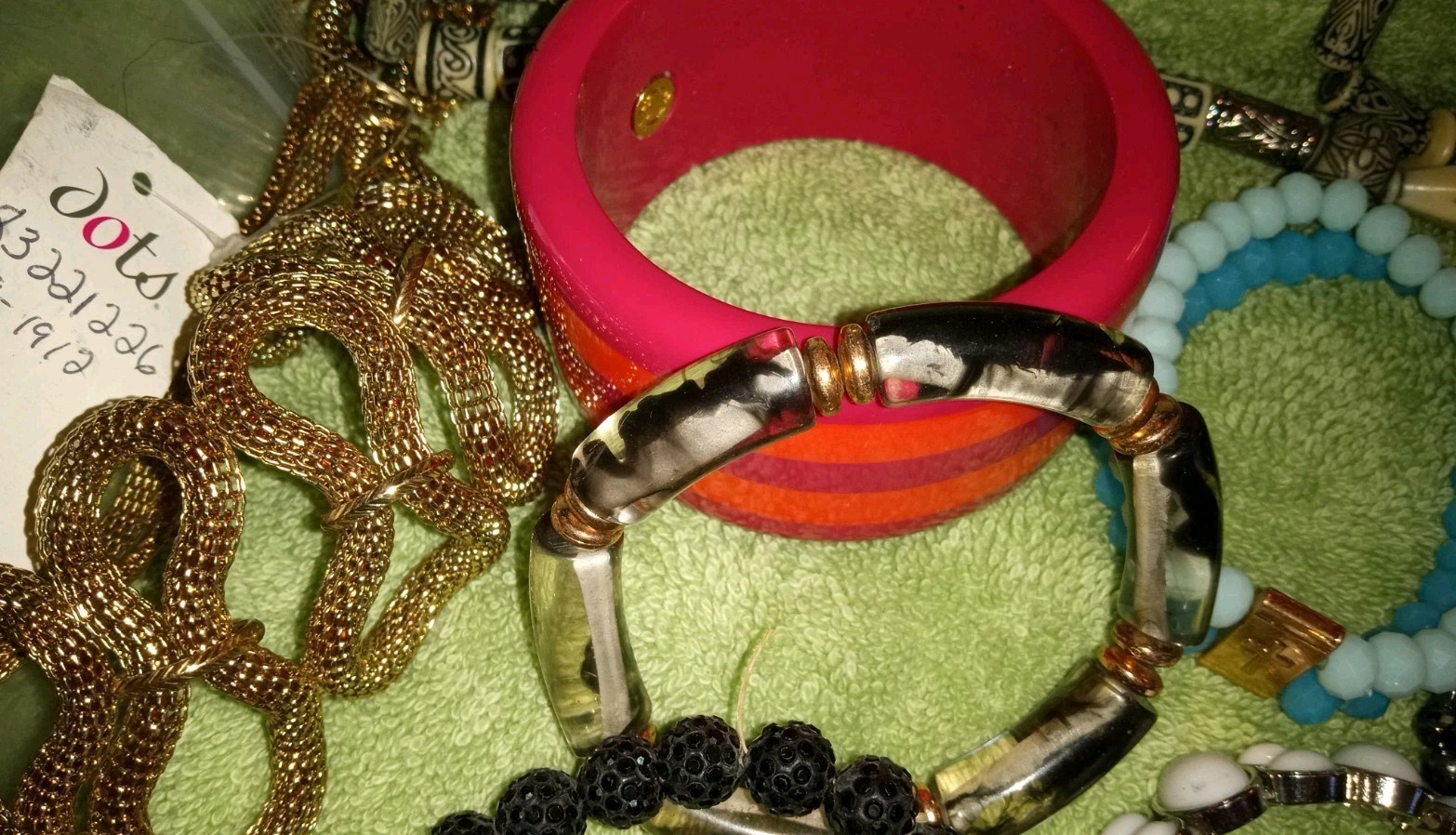 MULTIPLE FASHION BRACELETS MOST STRETCHY BUT SOME PRETTY ONES, SOME SIGNED BRASS