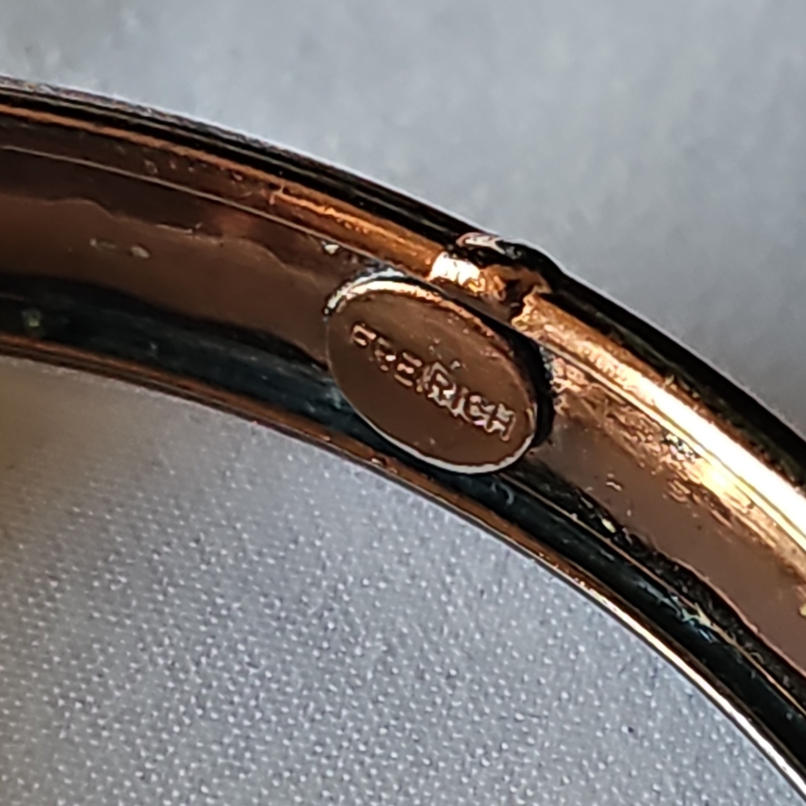 Frerich Signed Gold Tone Hinged Metal Bangle Bracelet w/ Safety Chain