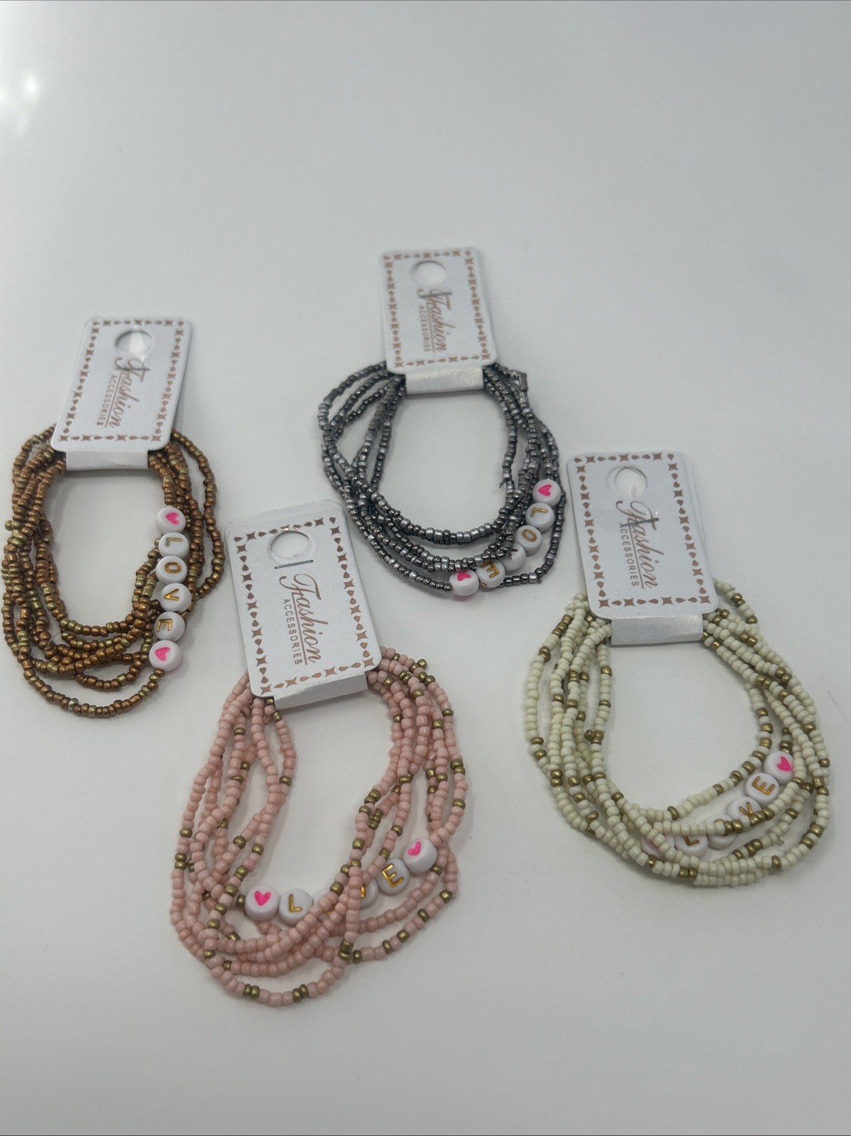 4 NWT Fashion Accessories Stacked Elastic Bead LOVE Bracelets Pink Cream Silver
