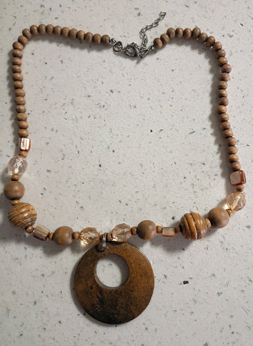 Brown wooden disc beaded necklace with lightweight wooden bracelet.