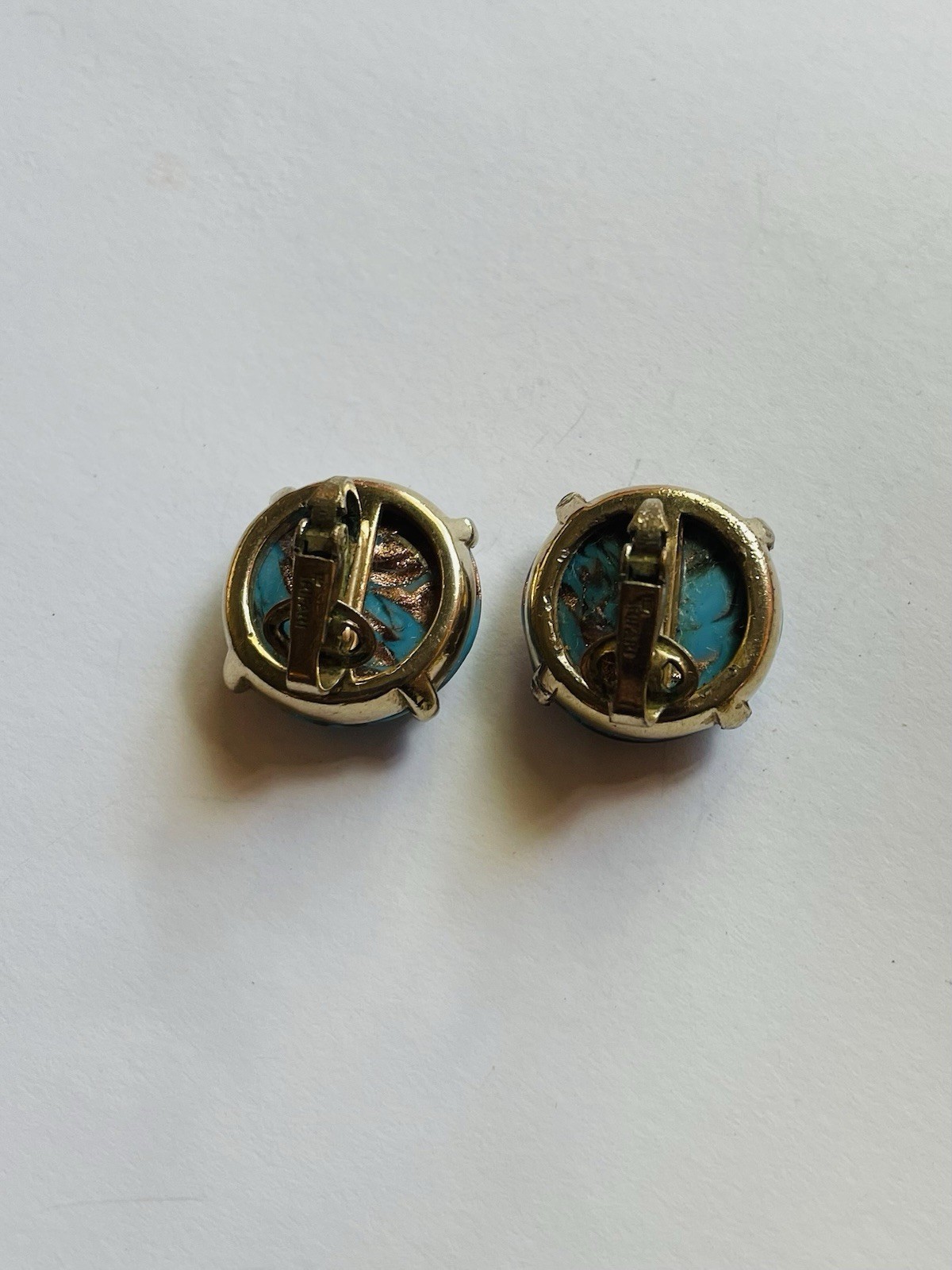 Vintage Crown Trifari round clip-on earrings, featuring turquoise cabochon
