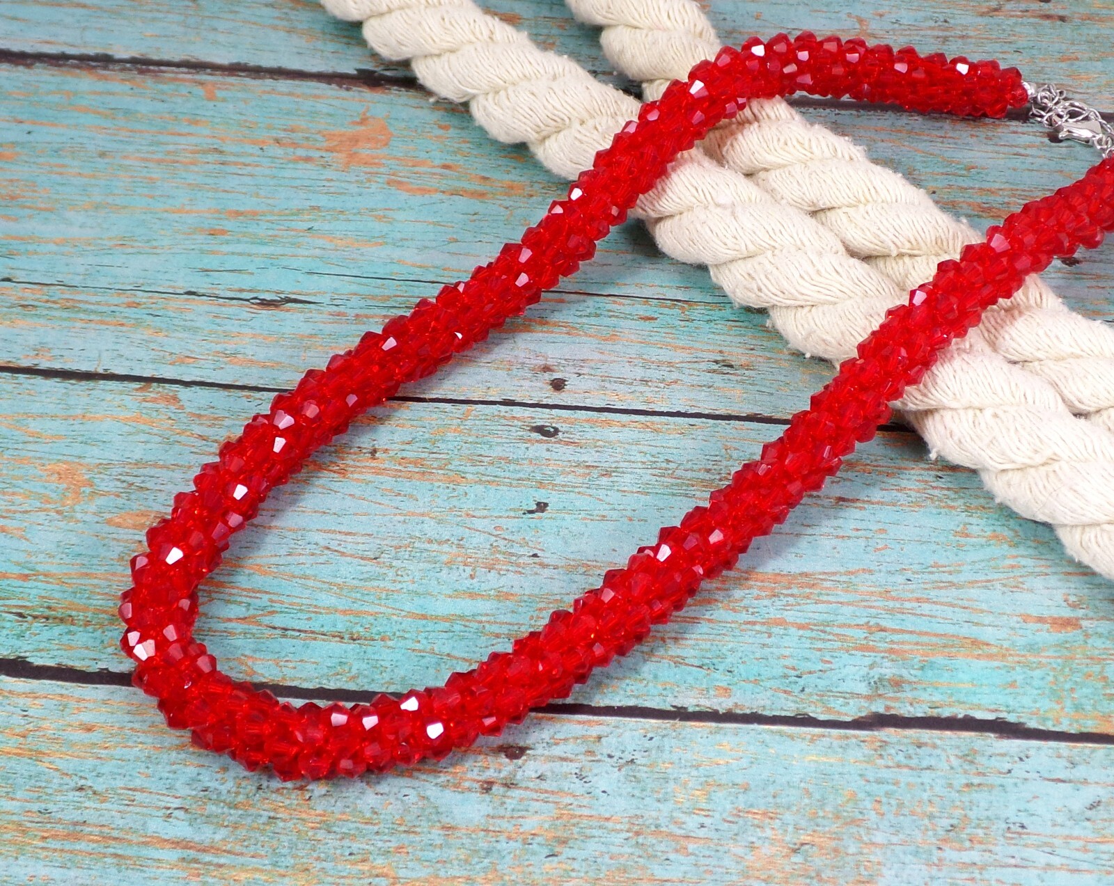 Red glass beaded necklace in a sparkling thick cluster beaded rope design New