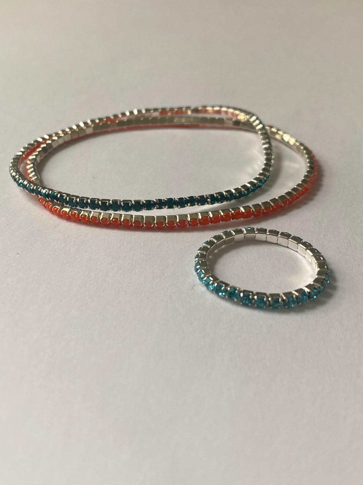5 stretchy bracelets and 4 stretchy rings, shiny and new