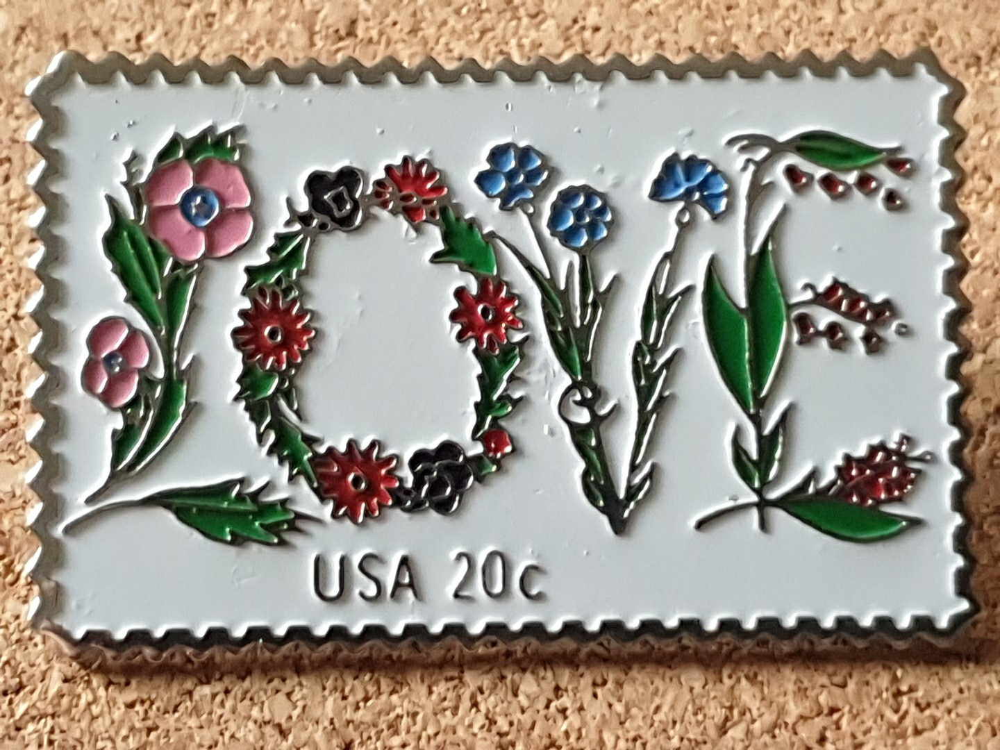 The March Co USPS 20c 1982 LOVE Stamp Floral Embossed Lapel Pin Back