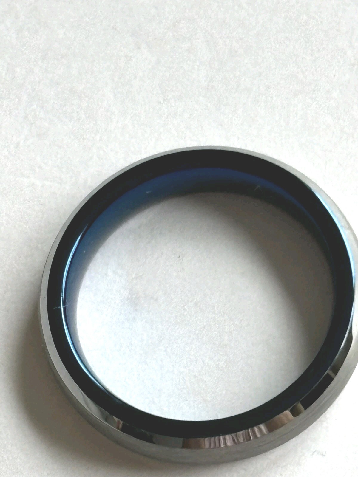 Stainless steel ring / size 4 / dark gray to black on outside /blue on inside