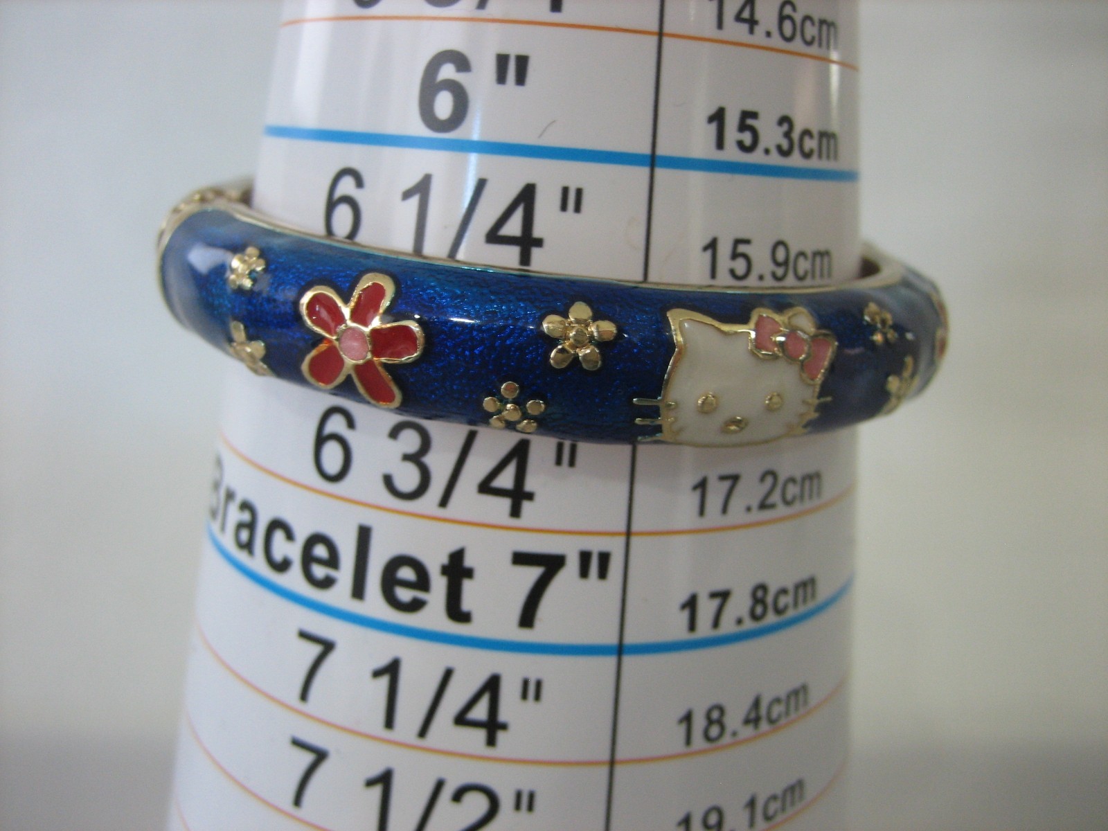 JIU LONG XING Hello Kitty Gold Tone & Blue Enamel Hinged Bangle Bracelet