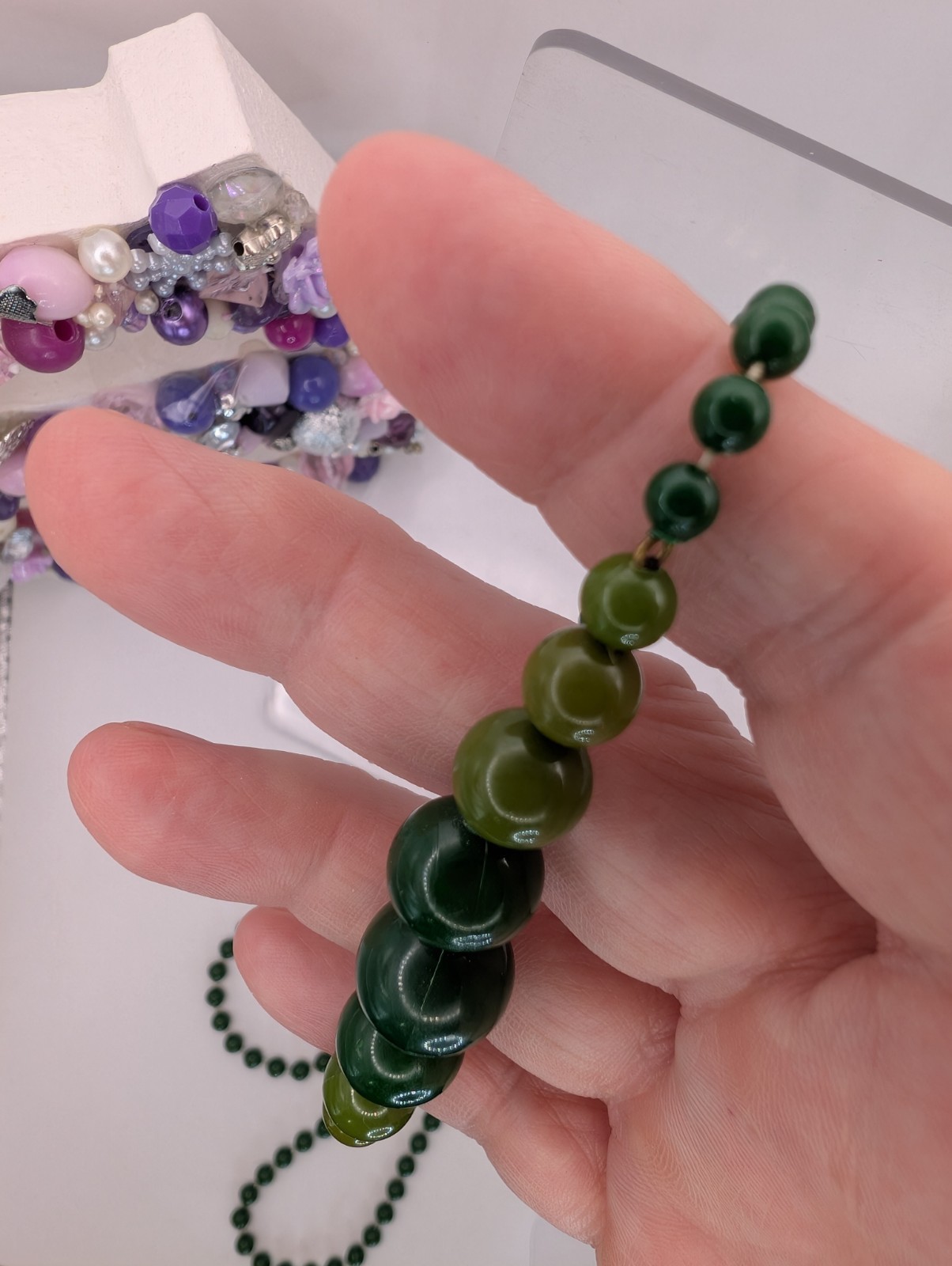 Long single strand green prominent graduated focal statement beaded necklace