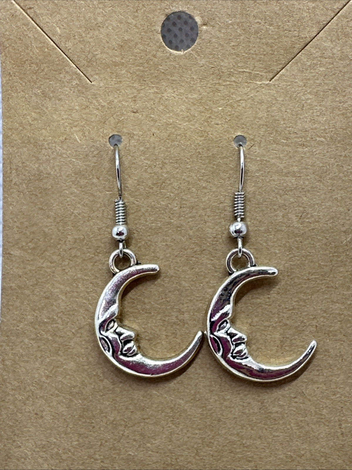 1″x1″ moon face dangling earrings