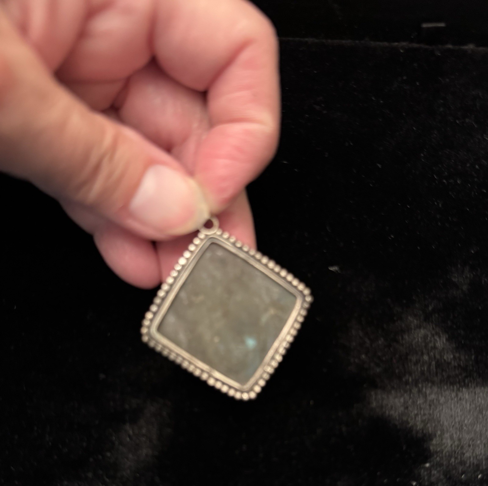 Square-cut natural labradorite pendant set in a textured silver frame. Vintage.