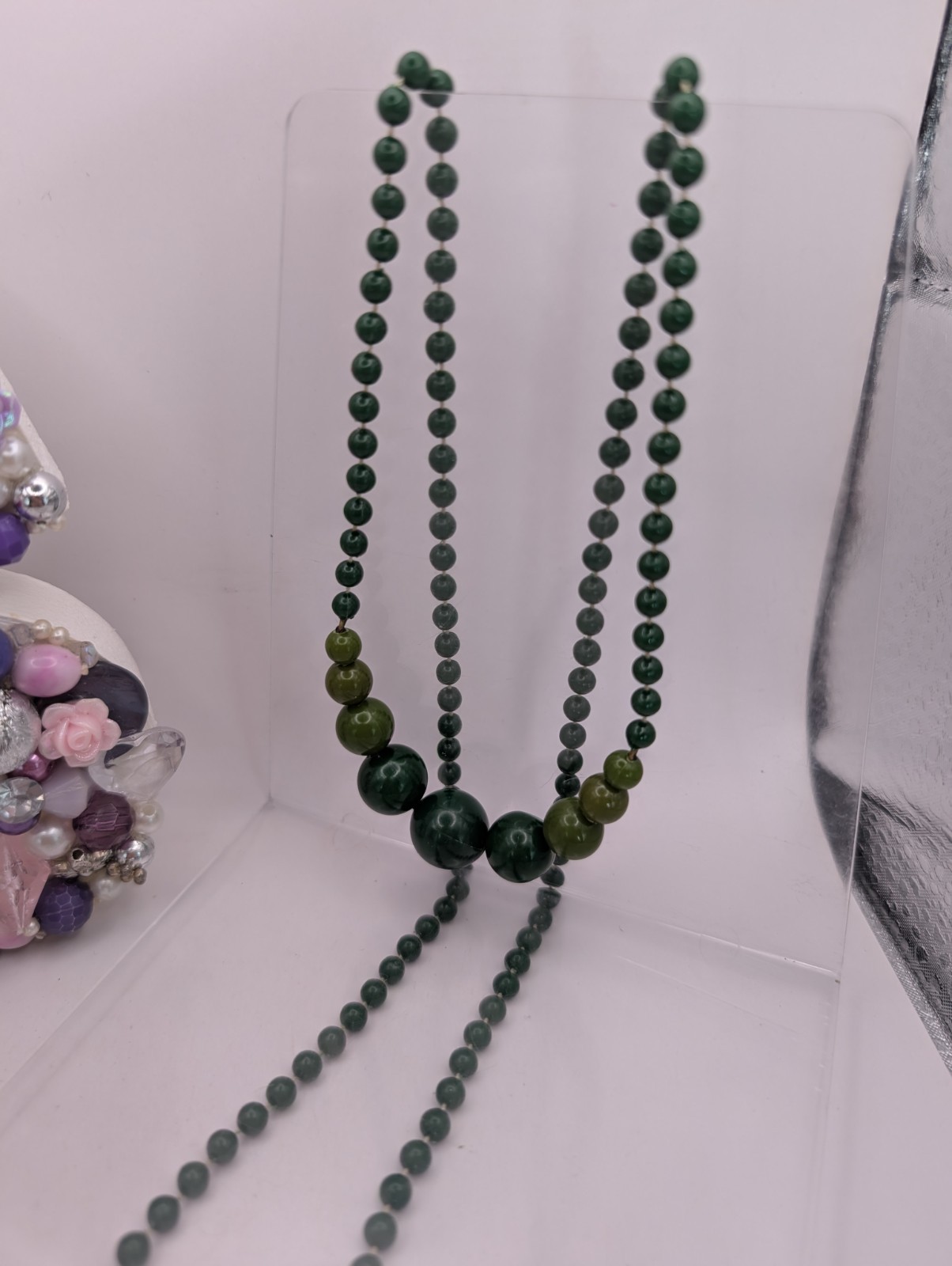 Long single strand green prominent graduated focal statement beaded necklace