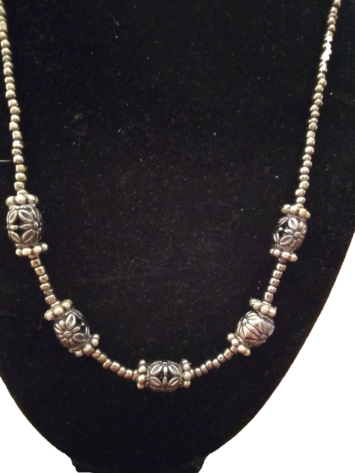 20″silver seed beads that features metal barrel beads with toggle clasp