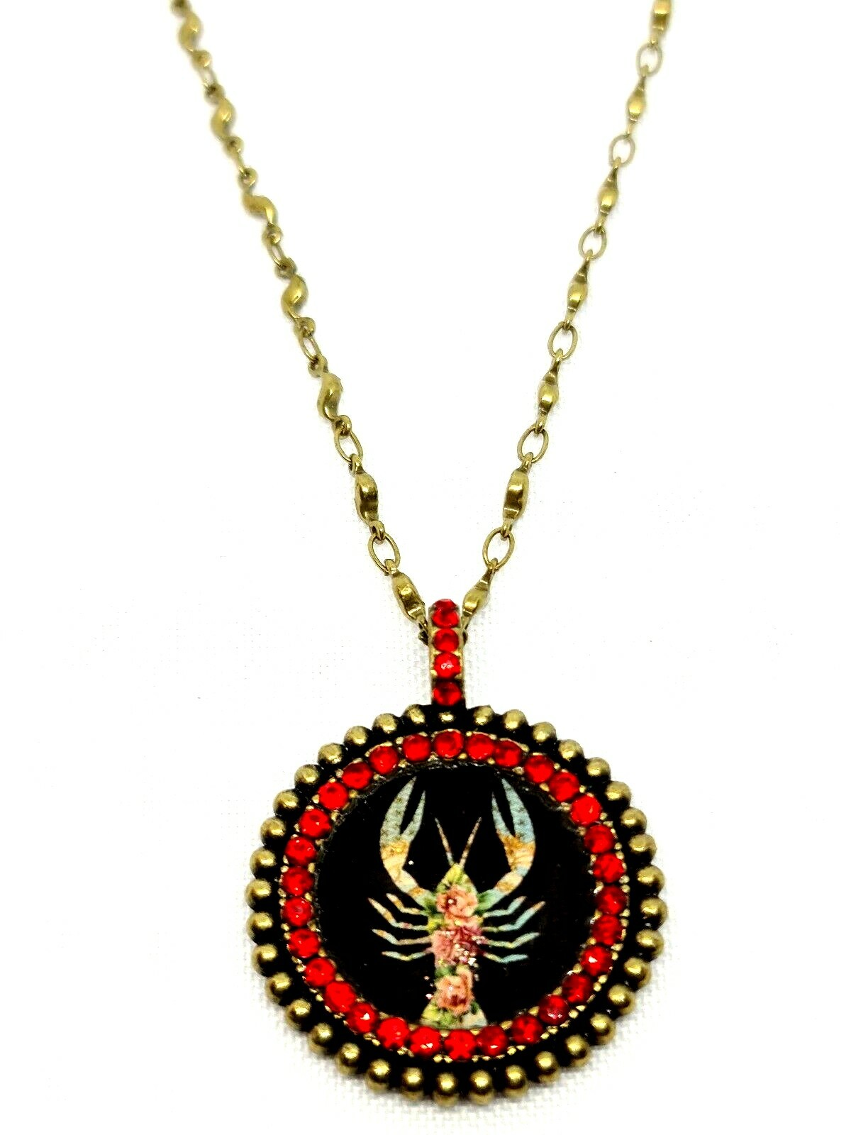 Lovely round Metal Necklace By Michal Negrin Red Crystal Cancer Sign.