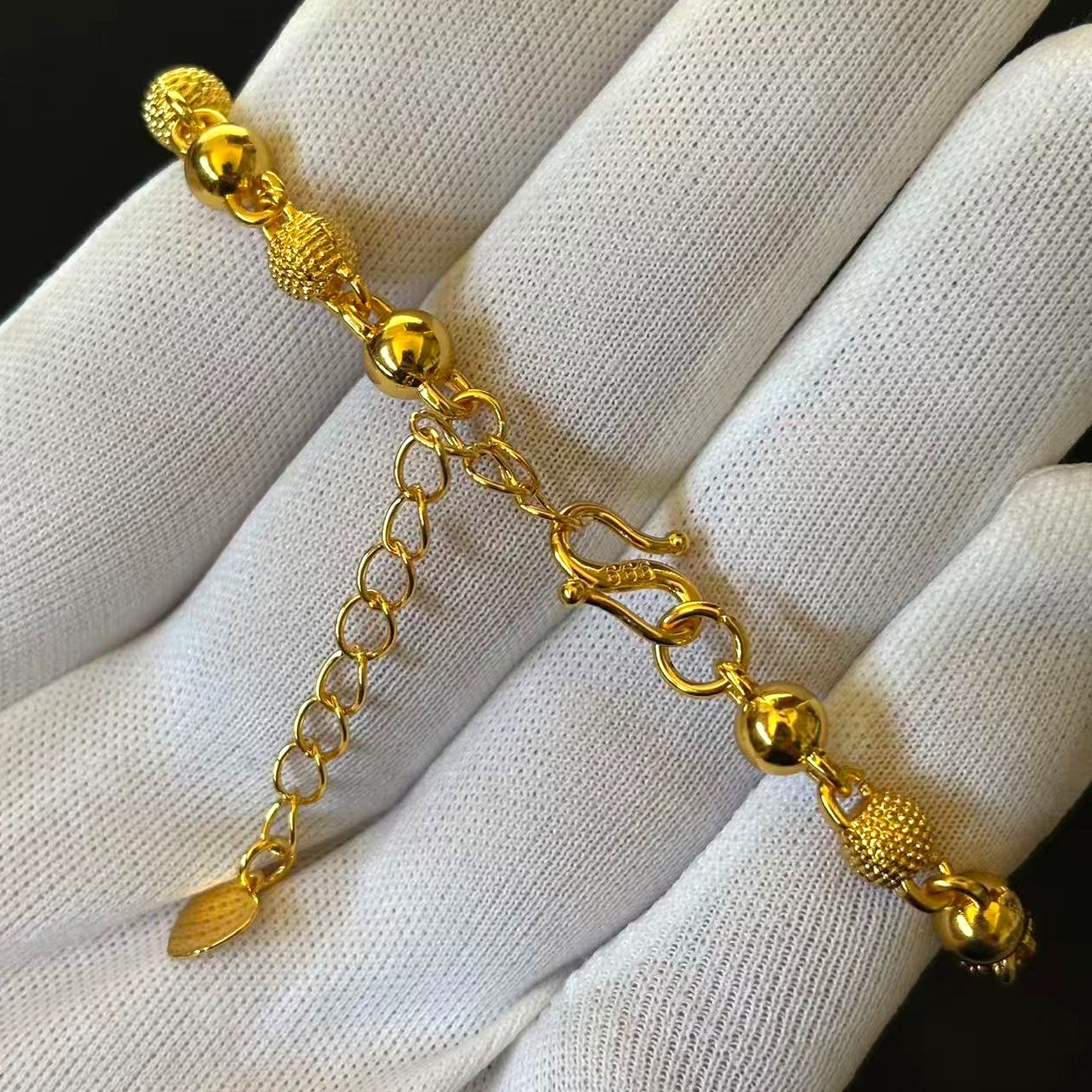 Golden Gold-tone Ball Bracelet Chain marked ‘ 999 ‘, 7-8.5 in adjustable