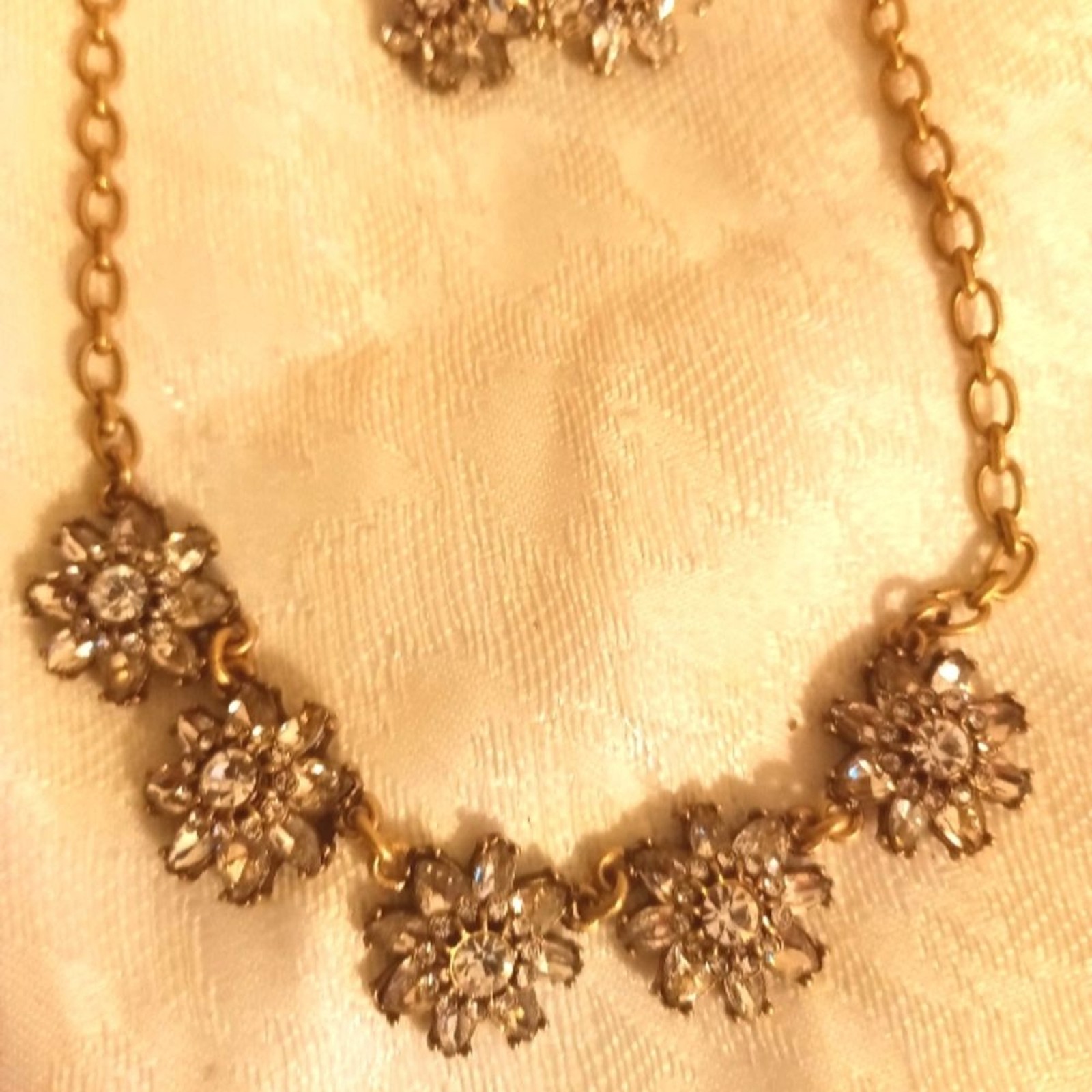 Chloe+Isabel flower rhinestone necklace and earring set. Antique gold