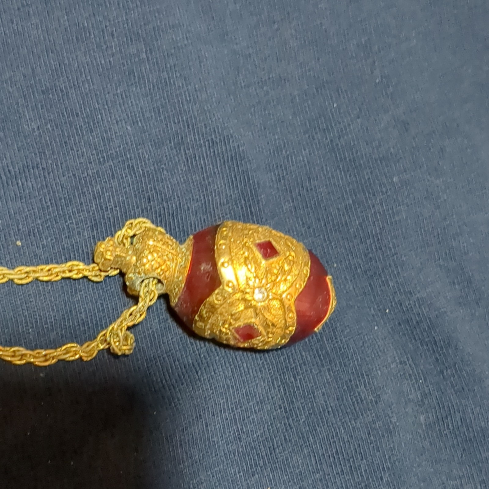Gold Tone Metal Rope Chain Necklace with Red Egg-Shaped Pendant