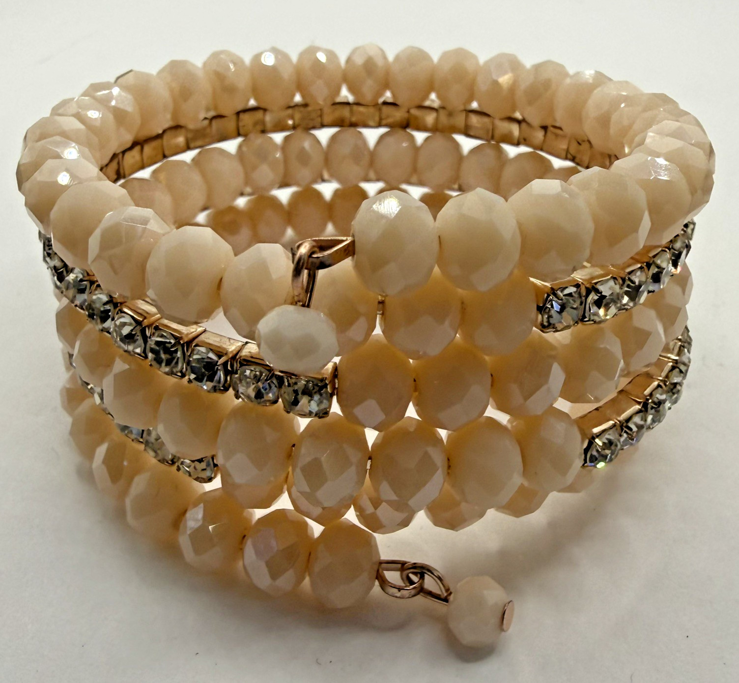 5 row crystal and gemstone coil layered bracelet 1 stone missing INC in box