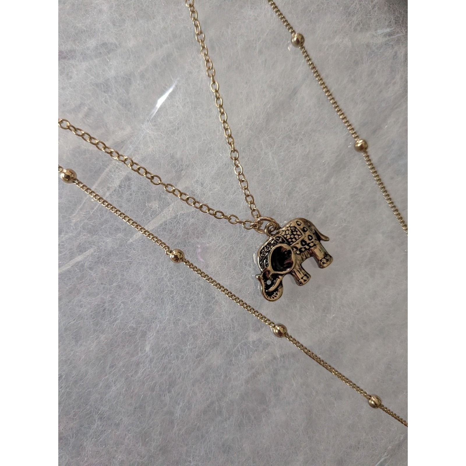 Bansri Boho Gold Tone Layered Elephant and Horn Pendant Necklace Etched Detail