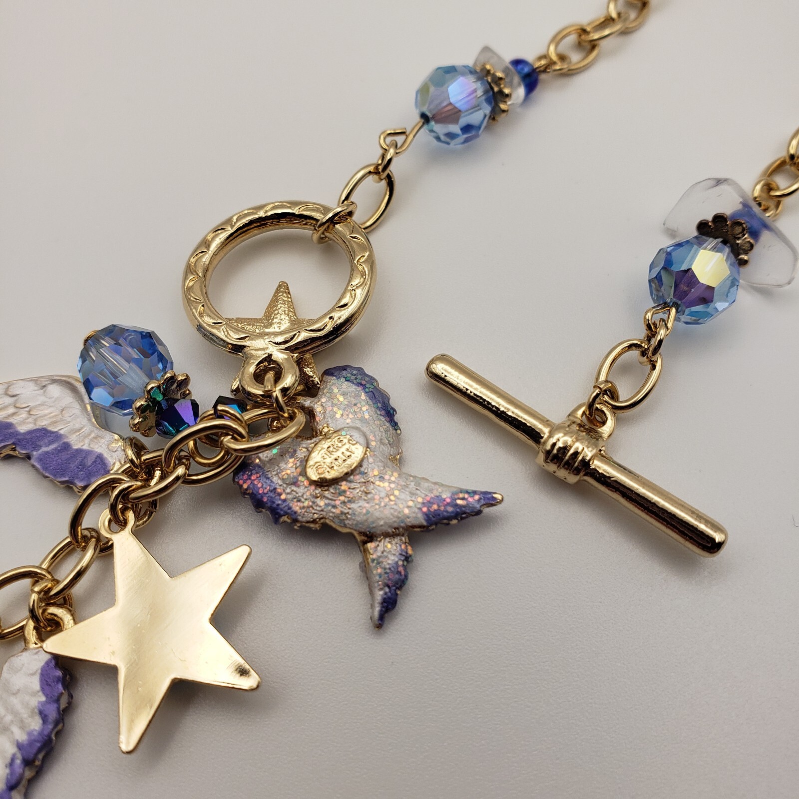 Kirks Folly Forever Angel Wings Charm Necklace Gold Tone 17in Long Blue Crystals