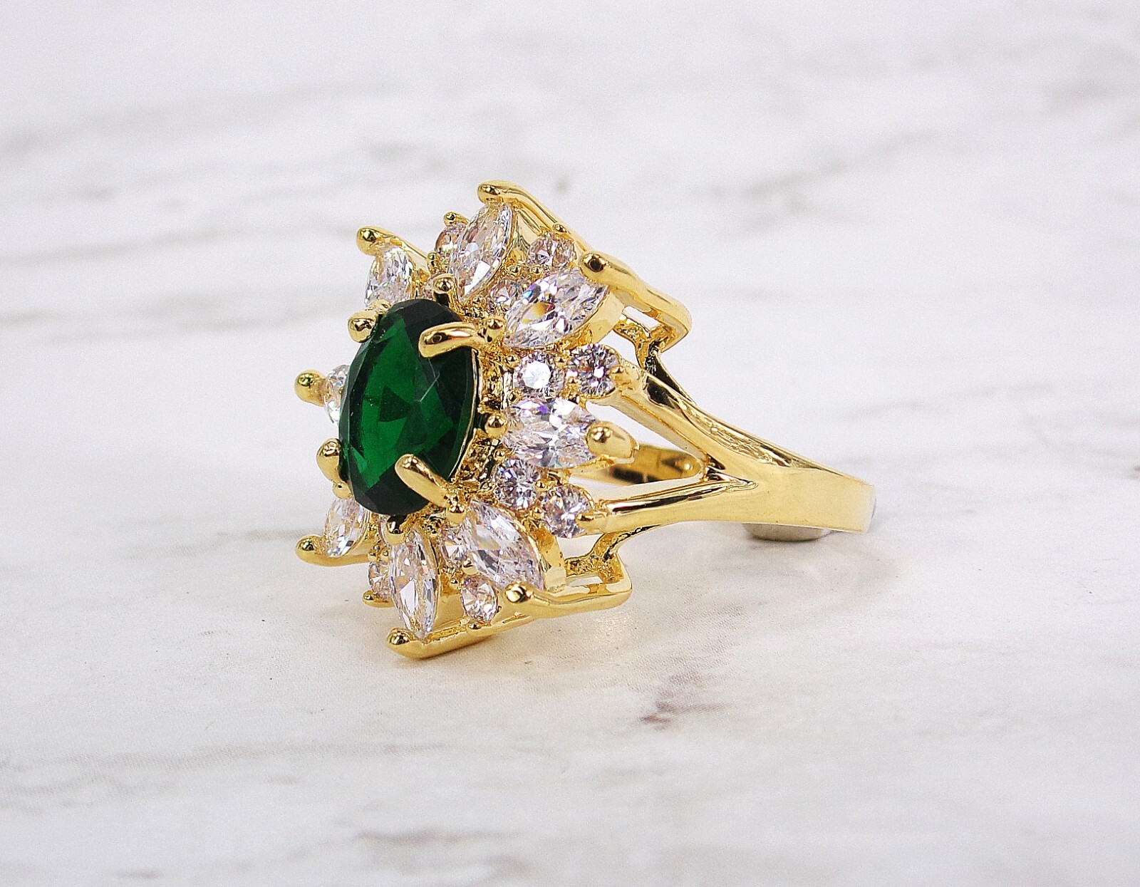 Large green oval cubic zirconia stone ring with clear marquise round CZ stones