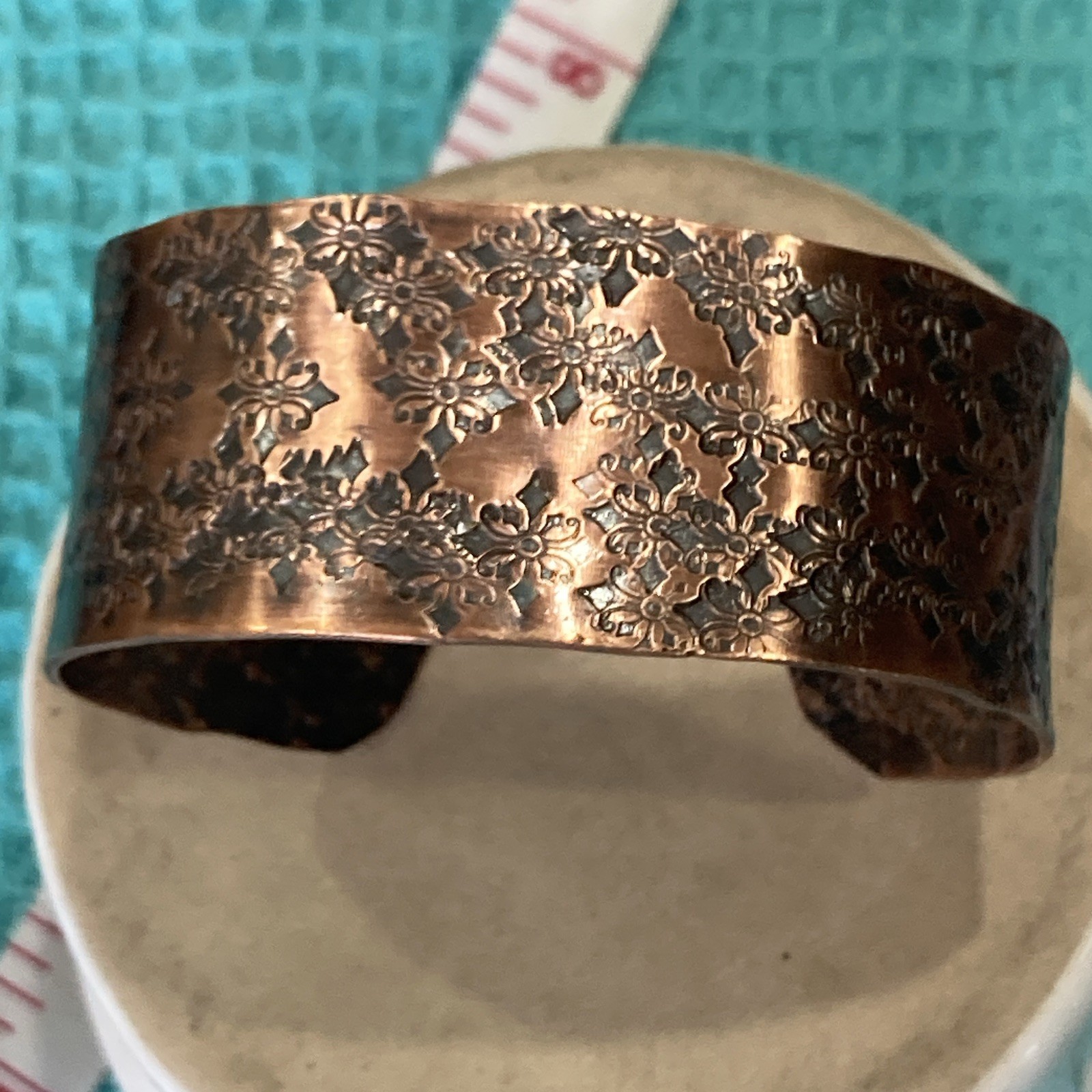 Wide floral embossed copper open-ended cuff bracelet, size 6.5 in, no stone