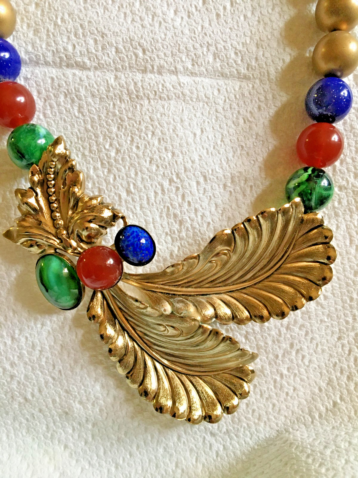 Ornate 18″ Necklace Golden + Stamped Metal Feathers? + Drilled Glass Beads
