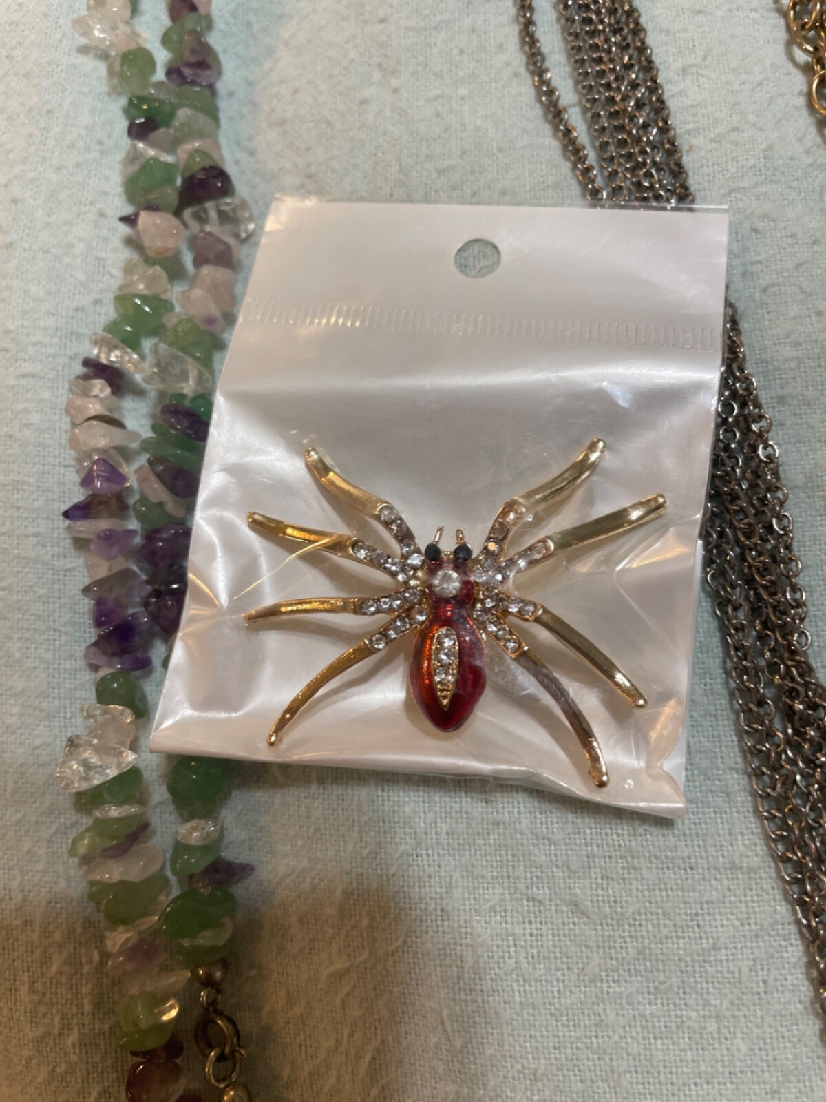 set amethyst necklace with enamel butterfly gold tone broch and 2 necklaces wit