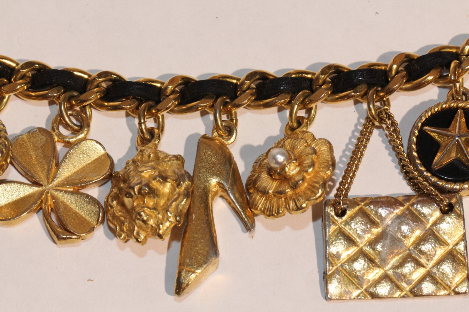 Chanel 1995 icon 12 charms gold chain with leather center bracelet